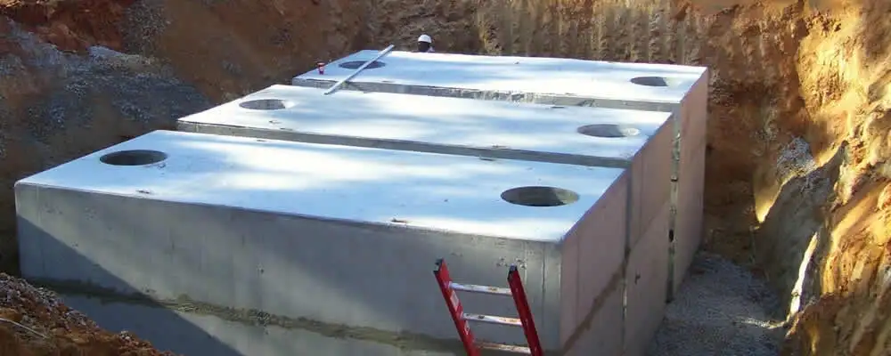 Septic tank installation site with a newly placed concrete tank in Mesa, AZ